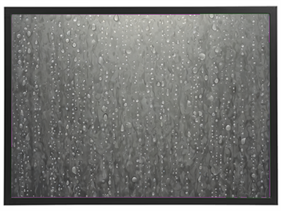 Et billede af dråber af vand, der sidder på en glat overflade, hvilket skaber et sløret og gråt udseende.